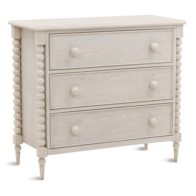 Charming white wash finish wood dresser with three drawers. Carved ball leg design with matching drawer knobs. Each may...