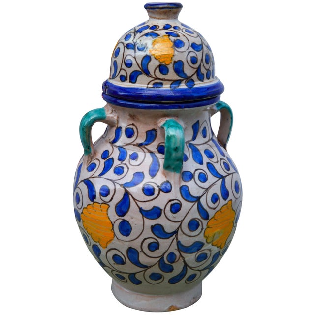 Vintage handcrafted ceramic vase from Fez, Morocco with a hand-painted Moorish pattern in blue, white, and orange. No...