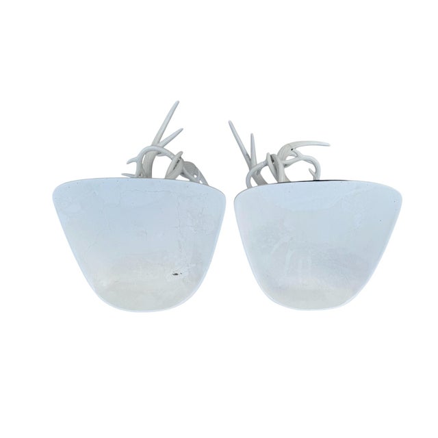 A pair of faux antler metal stools with metal saddle seats. The metal antlers are extremely realistic and make for a great...