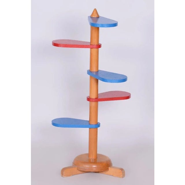 This Mid-Century flower stand from the mid-20th century was made in Czechoslovakia. Crafted from beech wood, it has...