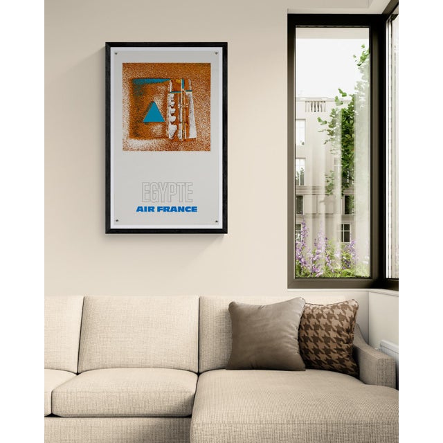 The Piece An original 1971 Air France travel poster promoting flights to Egypt, designed by Raymond Pagès. The composition...