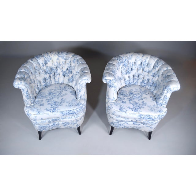 A stunning pair of fully restored 1920s era Art Deco barrel Bergère chairs in blue-and-white French toile fabric...