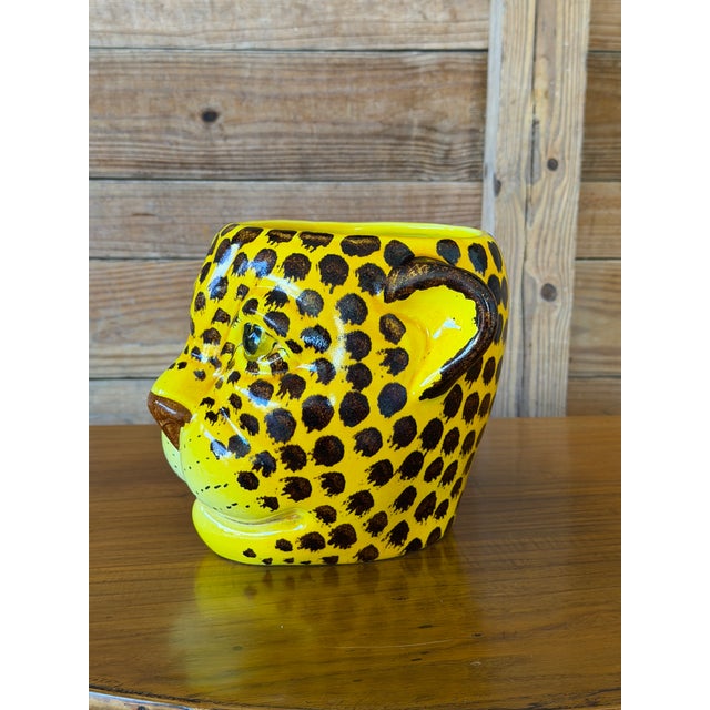 Bold, playful, and absolutely eye-catching—this vintage Italian ceramic planter features a sculptural leopard head...