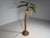 A striking Mexican palm tree floor lamp from the 1970s, crafted from bamboo and rattan. Designed by Mario Lopez Torres....