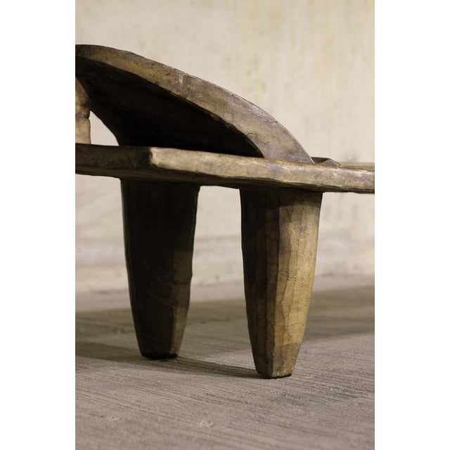 This hand-carved Senufo bed is an extraordinary piece rooted in the artistic heritage of the Senufo people of West Africa,...