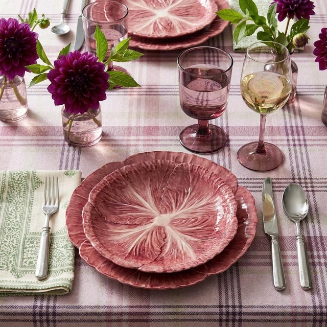 Cast in the trompe l'oeil majolica tradition, this dinner plate is molded and hand-glazed to read as an open radicchio...