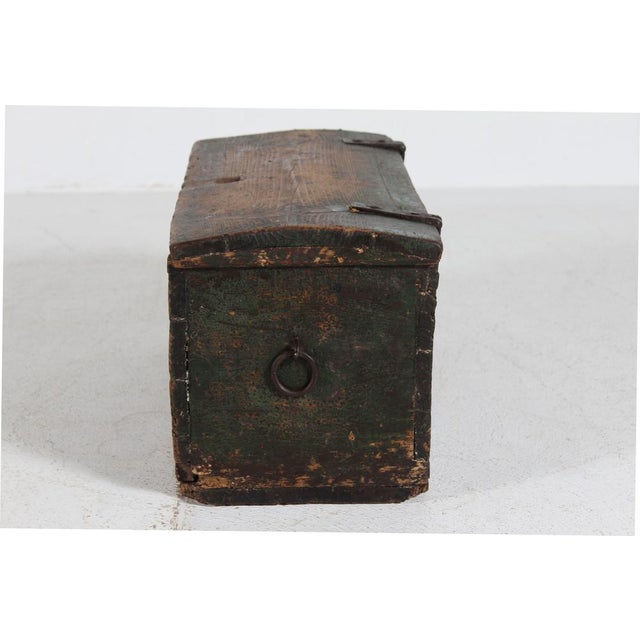 Small rustic storage chest of pinewood with green paint, that is worn of at the most exposed places. Handcrafted by...
