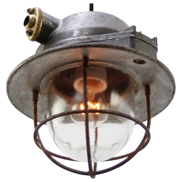 Industrial hanging lamp by emd, france. cast aluminium, brass and frosted glass e27 / e26 this piece has an attribution...