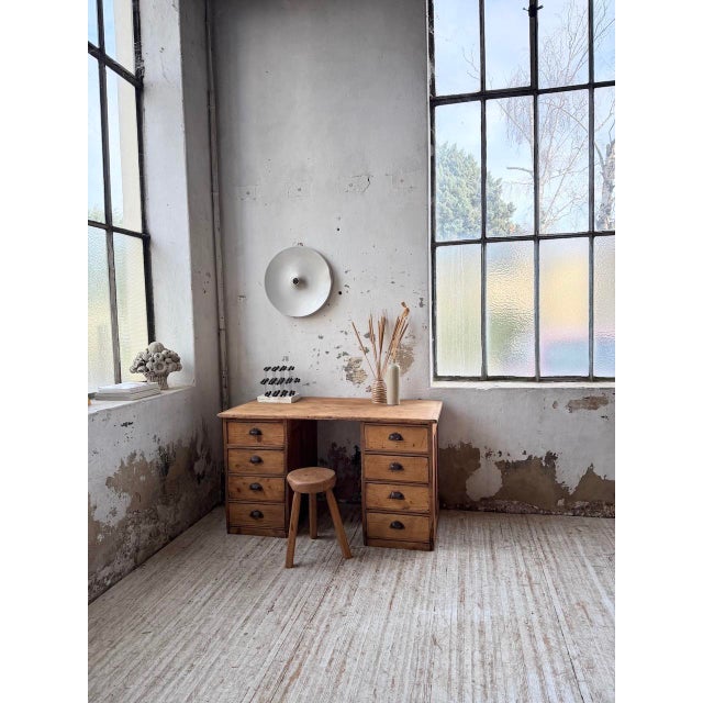 Antique pine desk, workshop style, from the 1950s. this desk was used in a cabinetmaking workshop. it shows signs of age...