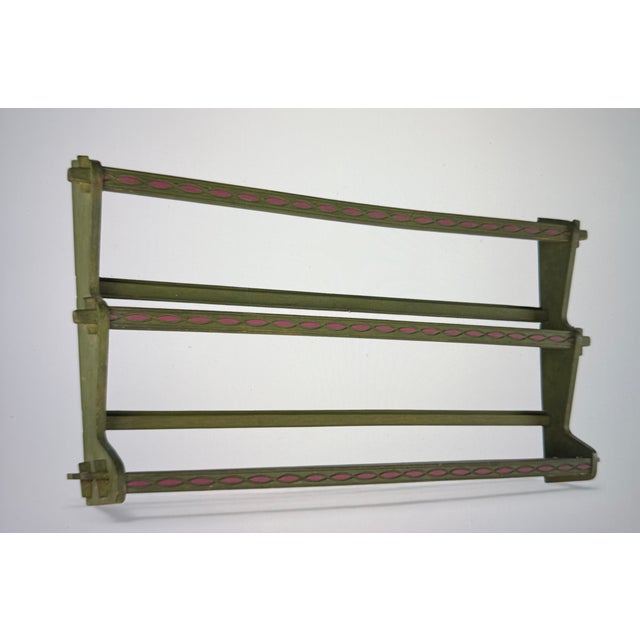 An old Swedish plate rack. Typical are the paintings with folk motifs. The rack measures 50 cm x 96 cm x 12 cm. The base...