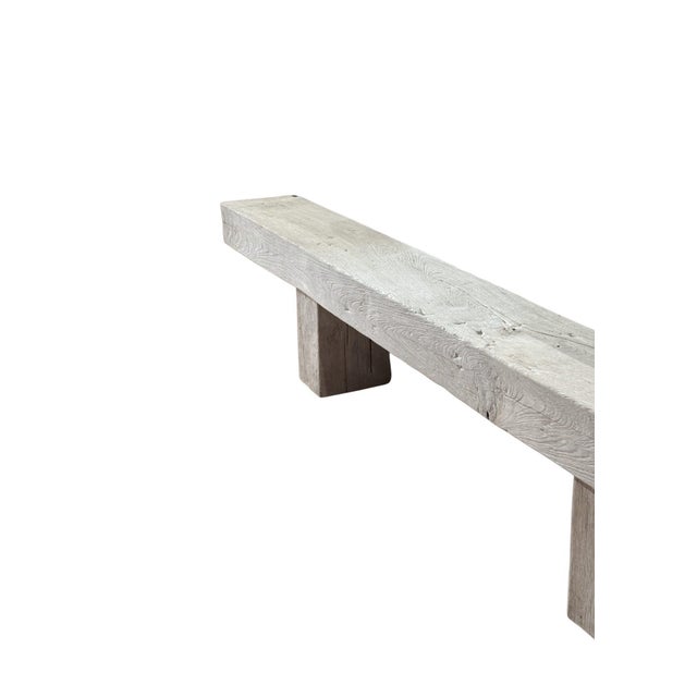 Crafted from solid teak wood, this sculptural bench embodies the quiet elegance of modern organic design. Defined by its...