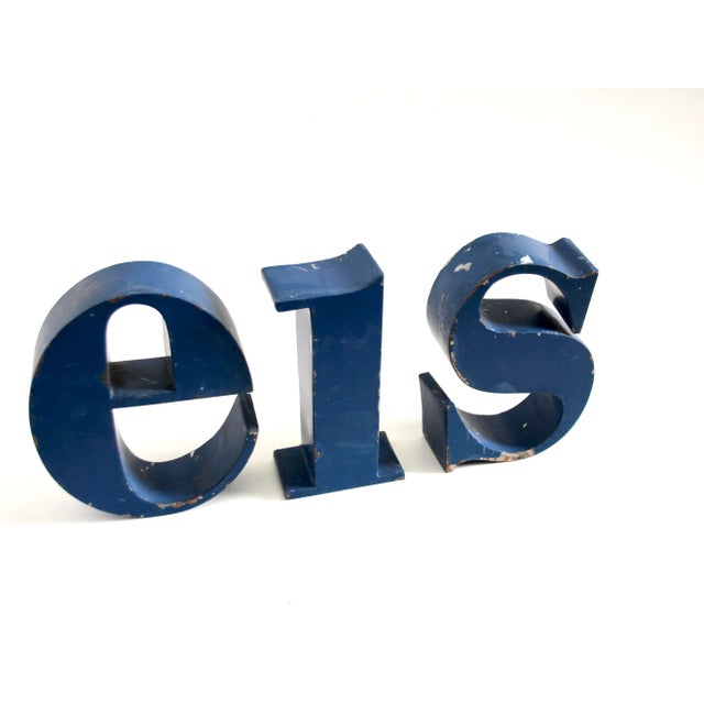 This set of vintage industrial letters was produced in France in the 1950s. The letters spell out the word 'EIS' or "SIE"...