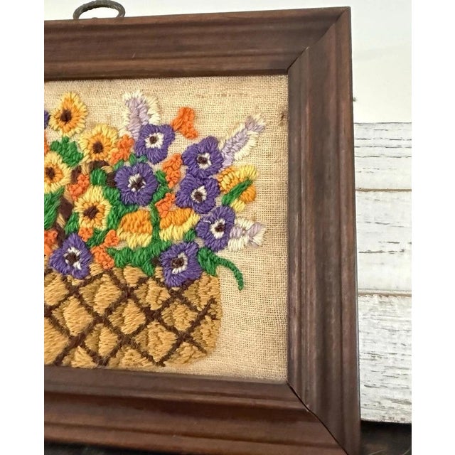 Add a warm, handcrafted touch to your space with this vintage floral crewel embroidery wall piece, presented in a charming...