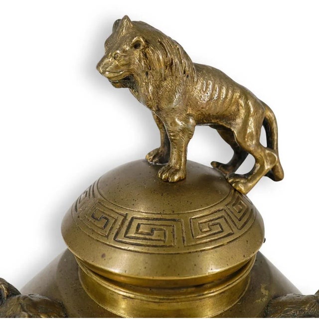 Antique French gilt bronze inkwell featuring decorated with puttos, satyrs, and scrolling foliage motifs and featuring...