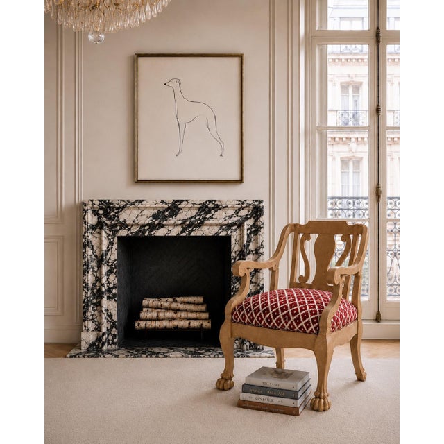 Striking vintage solid oak occasional chair featuring a sculptural frame, gracefully curved arms, intricately carved ball...