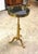 Maison Toulouse style solid brass telescoping side table with black marble in the French Style on tripod base....