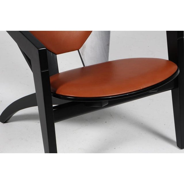 Hans j. Wegner lounge chairs new upholstered with cognac pure aniline leather. Frame of solid new black lacquered beech....