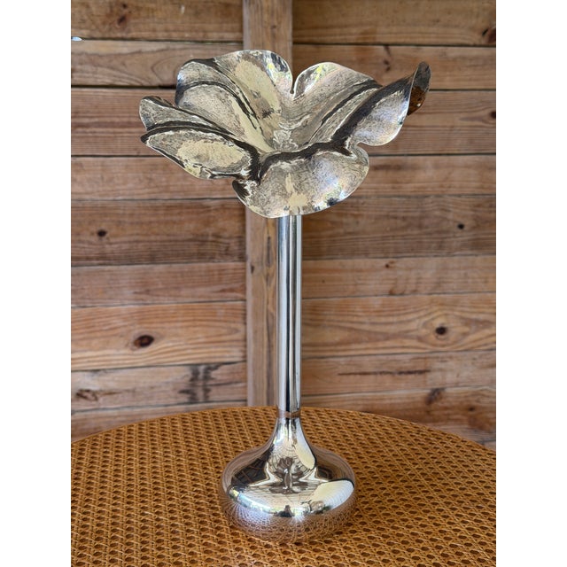 A striking vintage sculptural candlestick or bud vase featuring an elegant flower-form top with softly hammered petal...