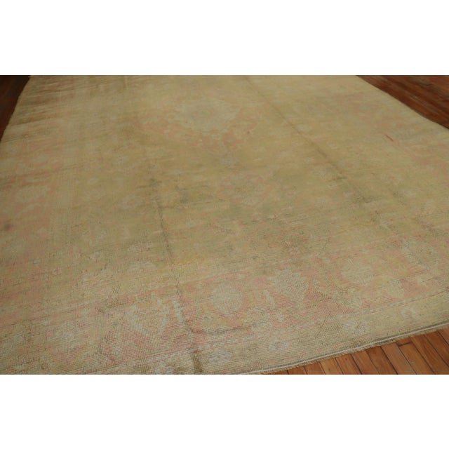 Pale Antique turkish oUshak with a medallion border design you can barely see. As pale as it gets!