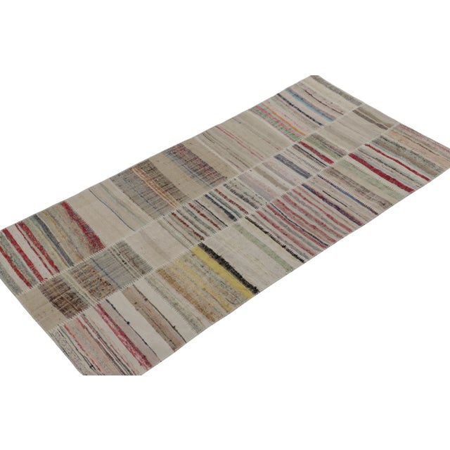 Handwoven in wool, Rug & Kilim presents a 4x8 contemporary rug from their innovative new patchwork kilim collection. On...