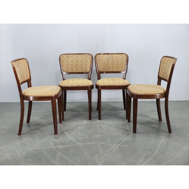 Set of four dining chairs produced by Thonet in Czechoslovakia during the 1940s. These chairs are crafted from solid beech...