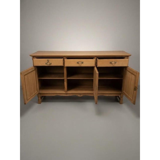 This is an absolute beast of a piece—a classic 1960s Danish Brutalist sideboard in solid Nordic oak, attributed to the...