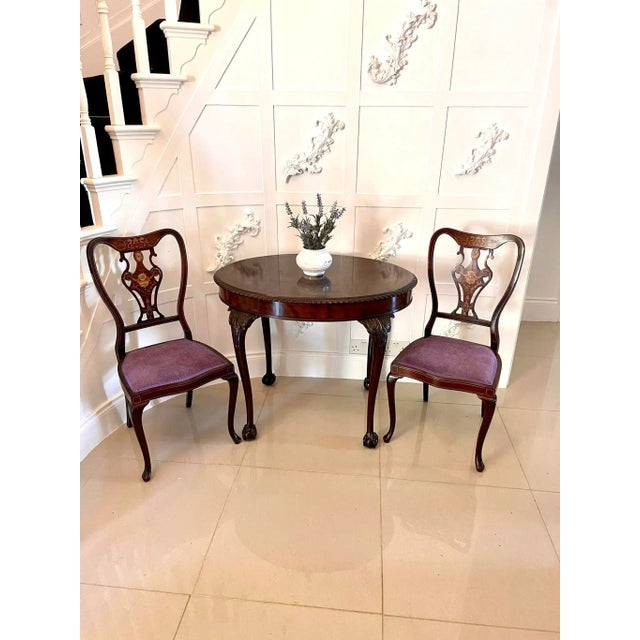 Antique quality oval carved mahogany centre table with a very attractive figured mahogany top and carved moulded edge. It...