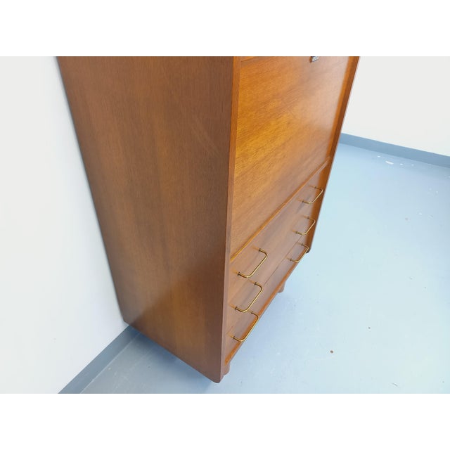 Vintage 1950s/60s secretary desk in oak, with brutalist-style cylindrical legs. It features one open niche, a secretary...