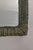 Woven Rattan Mirror – 1970s Arched frame crafted in woven rattan stained in a dark green finish.