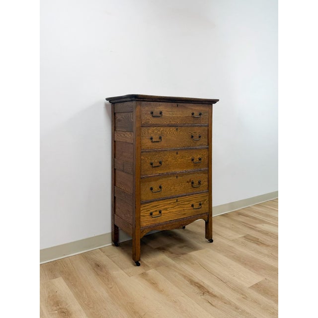 This antique oak five drawer dresser is a sturdy, characterful piece of vintage bedroom storage with the warm tone and...