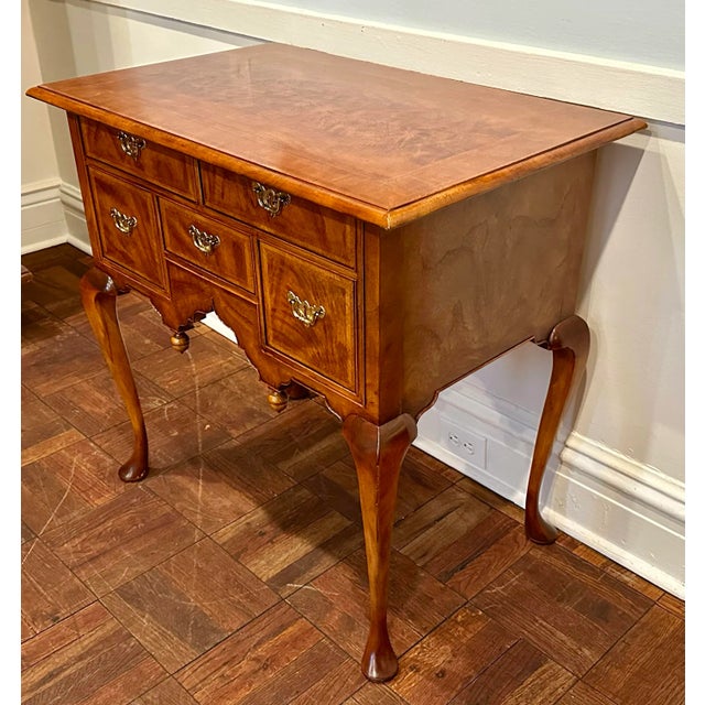 An exact museum copy of a Massachusetts Queen Anne dressing table dated circa 1730–60, made by Baker Furniture for the...