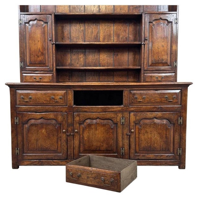 A substantial early 20th-century English dresser, finely constructed from oak and distinguished by its impressive scale,...