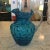 Beautiful hand-blown textured art glass pitcher with a scalloped rim. The fused ribbed glass handle is transparent and the...