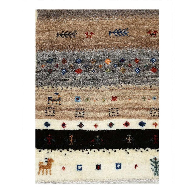 Gabbeh rugs are made by the nomadic Qashqai tribes of southern Persia. They are rough cut and long piled rugs of rich...