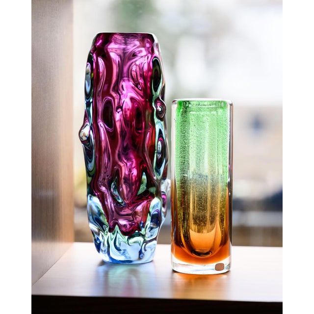 Pair of hand-shaped Czech art glass vases from the Škrdlovice glassworks, combining Jan Beránek’s 1959 “Red Core” model...