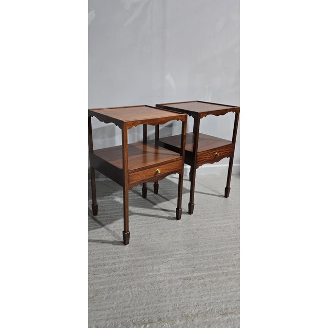 A very good pair of Georgian style solid mahogany night or lamp tables, each with a single drawer, standing on spade feet...