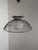 Striking vintage space age pendant lamp by the iconic Harvey Guzzini aesthetic. This elegant suspended lamp features a...