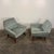 Pair of mid-century modern atomic style lounge chairs. These chairs feature tapered, walnut legs and stretchers, an...