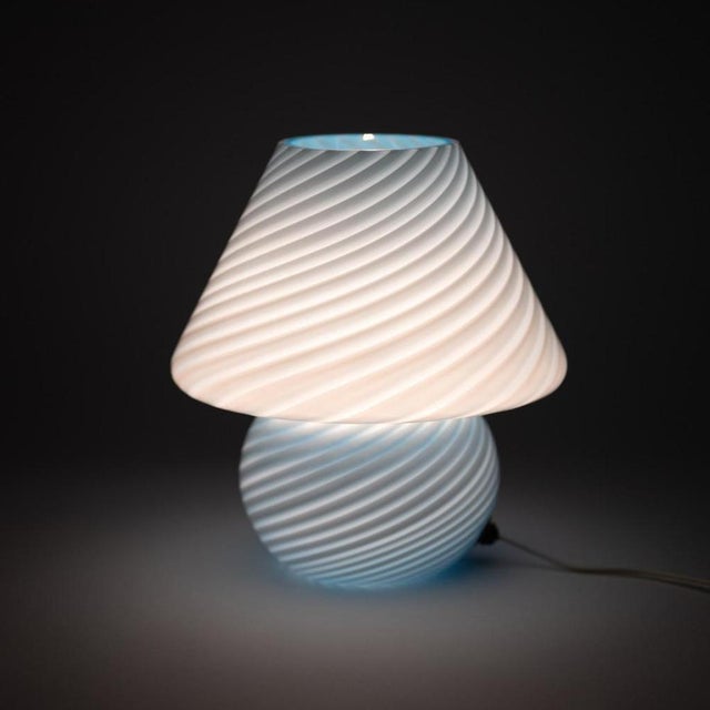 Murano glass lamp in the shape of a mushroom made using the swirling technique of mouth blown glass. Murano art glass is...
