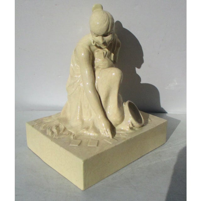 French 1930s' Femme fatal lady. A fortune teller reading the cards in a very beautiful and striking poise kneeling to read...