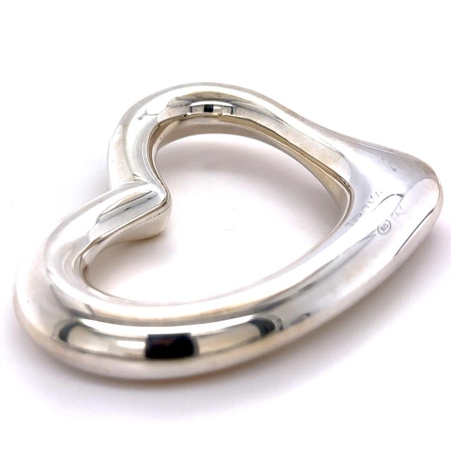 A rare Tiffany & Co. Elsa Peretti Open Heart baby rattle crafted in sterling silver, featuring Peretti's iconic open heart...