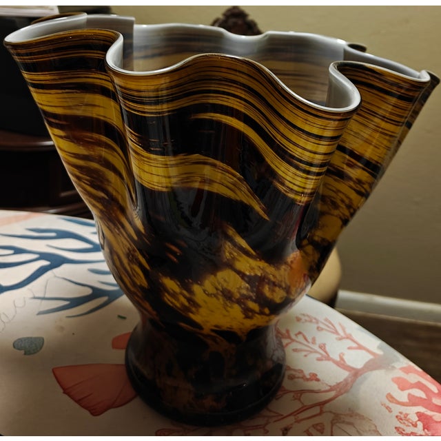 This vase is a stunning example of vintage Venetian artistry. The fazzoletto vase was hand blown on the island of Murano,...