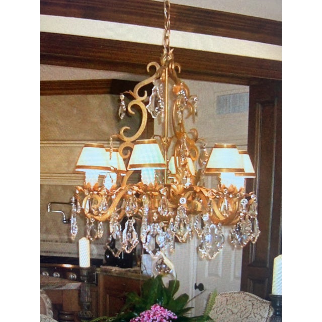 This hand-forged wrought iron chandelier is beautifully decorated with hand-cut European Crystals sure to complement any...