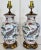Pair of vintage ceramic ginger jar table lamps with a vibrant, painted fish motif. These lamps feature a rounded, classic...