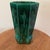 This rare emerald green ceramic vase features an etched design and geometric runes symbols, adding a unique and artistic...