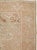 This mid-20th-century Turkish Anatolian accent rug presents a softly articulated floral composition in muted blush, sand,...