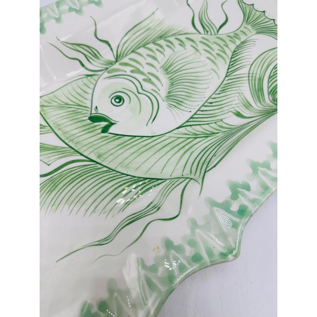 This is a hand-painted ceramic platter from the Mariposa collection, made in Italy. It features a scalloped edge with...