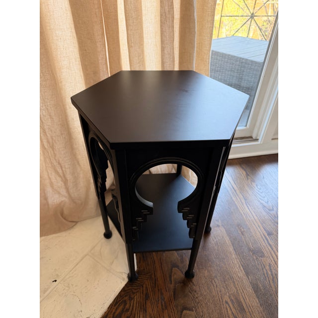 Striking and sculptural, this Global Views side table features a bold Moorish-inspired silhouette with dramatic keyhole...