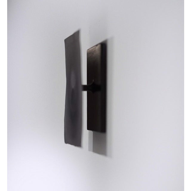 This artwork presents a striking interplay between pan pastel on Italian Turin leather and a minimalist welded steel base....