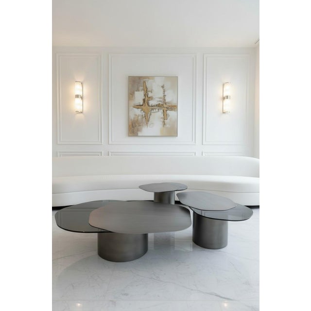 The Modern Irregular Kaylee Coffee Trio Table Set is here to impress. This set of 3 coffee tables will add a touch of...